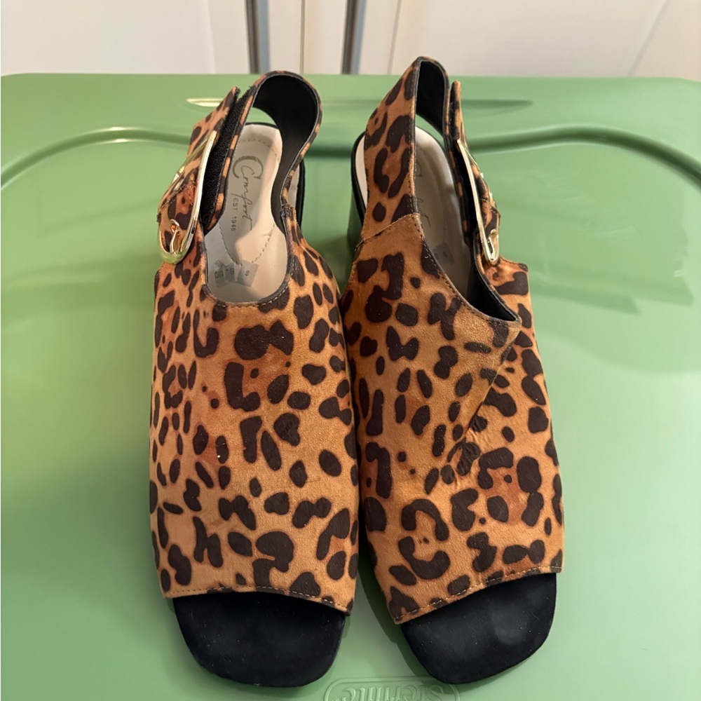 C. Wonder Brown and Black Mules with Leopard Print